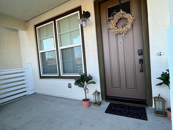 Front door area has a small space for a a bench if desired