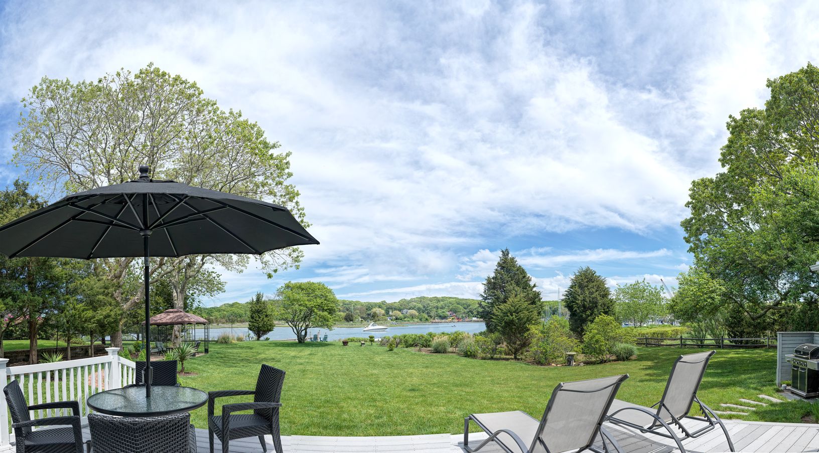 Open vista from waterside deck. Enjoy coffee in the morning, lunch or dinner in the evening.