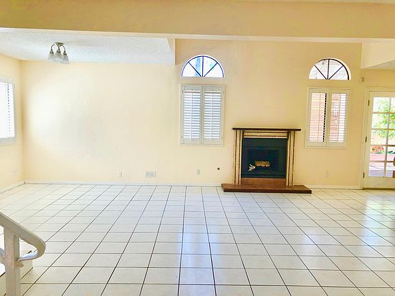 Fireplace with French door entrance to the patio