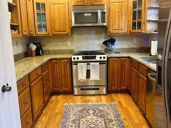 Kitchen includes refrigerator, gas oven and stove, microwave, dishwasher, disposal, large pantry and plenty of storage space!