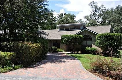 front view of home and circle paver drive way