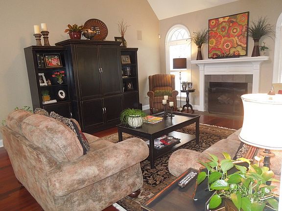 Beautiful built in arched windows accent living area.