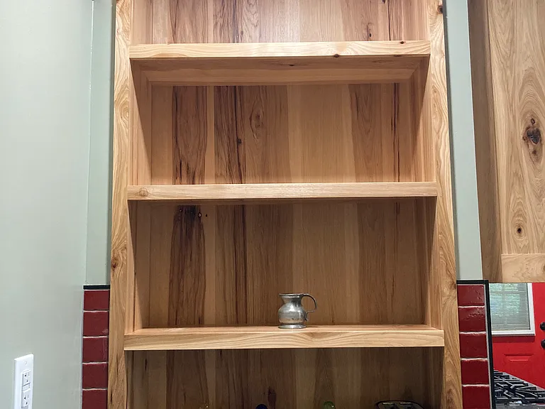 Expertly crafted shelving in the kitchen.