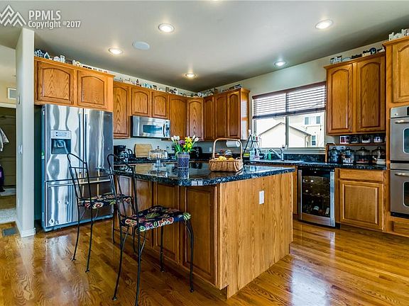 Beautiful Kitchen. double ovens, stainless appliances, wine refrigerator.