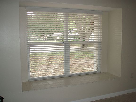 New windows and blinds throughout