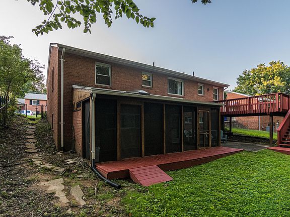 Screened Porch opens to lovely rear yard