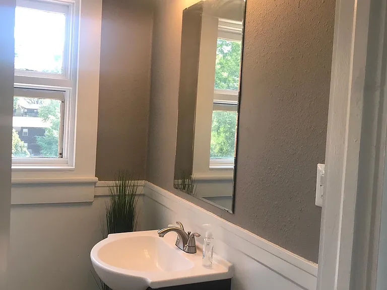 Full bath downstairs next to office.