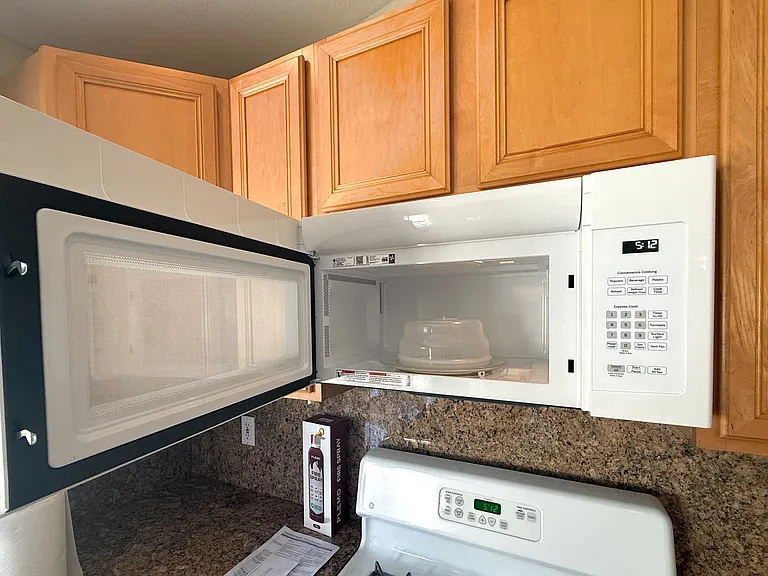New General Electric Microwave with food cover