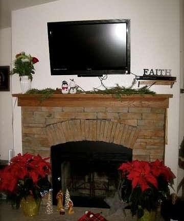 Wood burning fireplace with wiring for flat screen t.v. to be mounted above mantel.