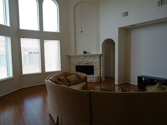 Den With Stone Fireplace