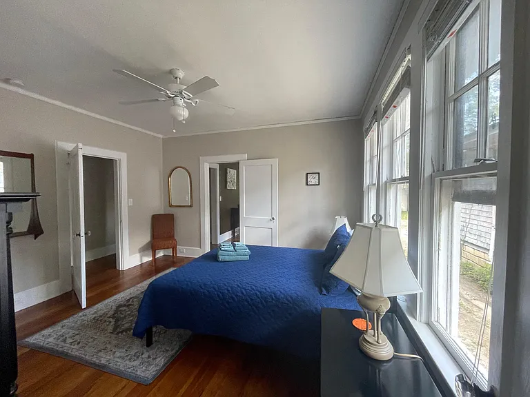 bedroom includes a queen bed.
