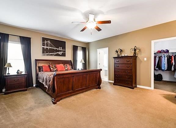 Large master suite with walk in closet and private bath.