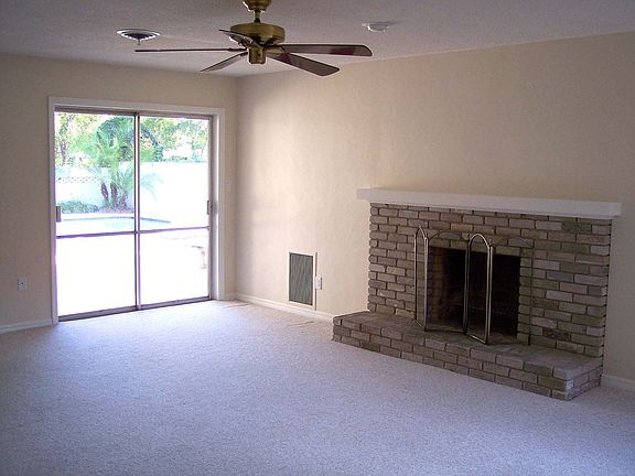 Family room with woodburning fireplace