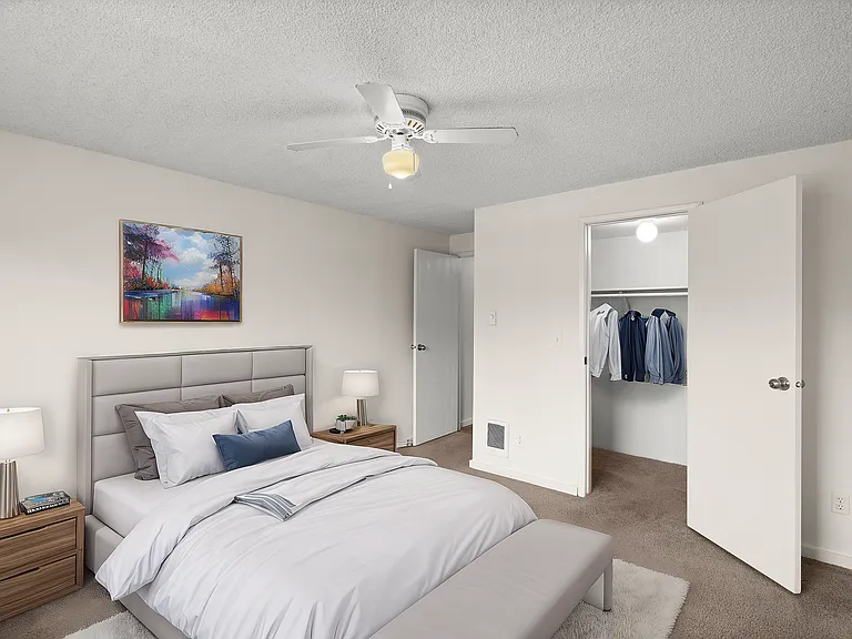 Relax in a serene bedroom featuring stylish decor and ample closet space. Relax in a serene bedroom featuring stylish decor and ample closet space.