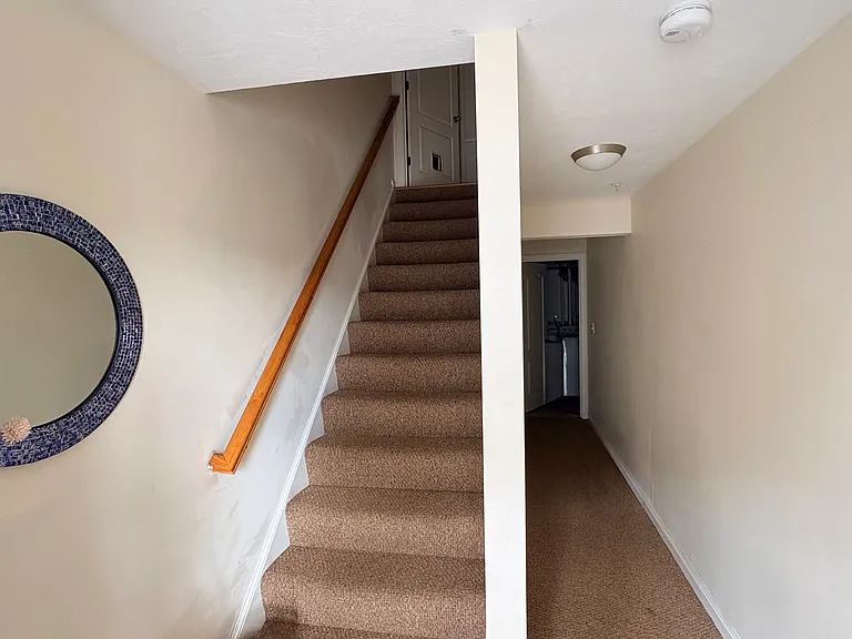 Entry way. Utility area with washer and dryer at this level on the right side