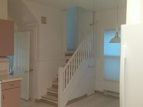 Back staircase from kitchen