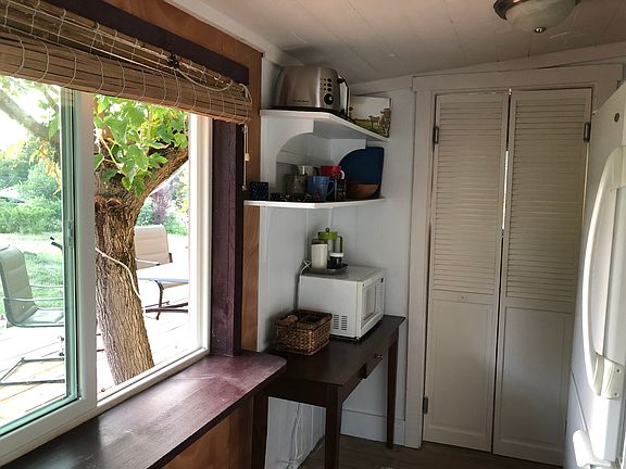 Kitchen has pass-thru window for serving food to the spacious deck