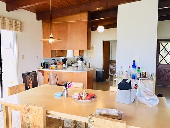 The eating area and living area are combined.