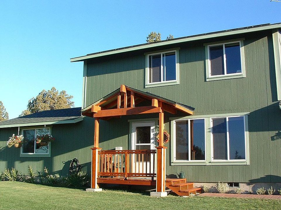 Front of home with new covered entry