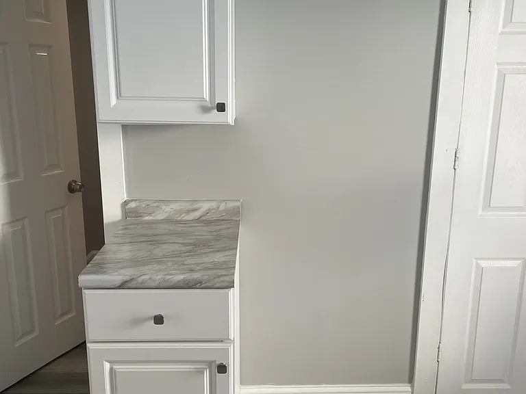 kitchen cabinet next to electric stove outlet