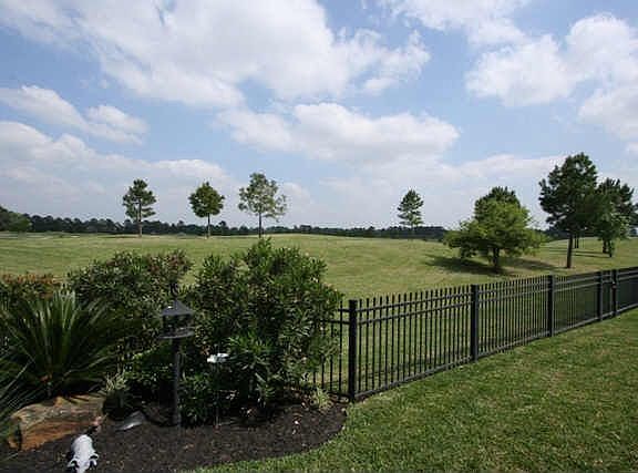 Wrought iron fence to course