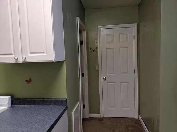Looking towards bathroom (left door)