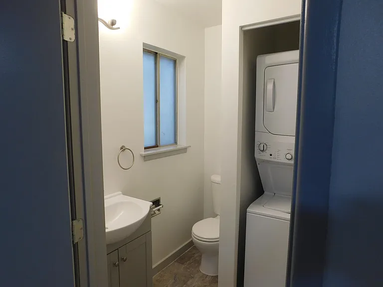 Second bedroom one-half bath with stack washer and dryer.