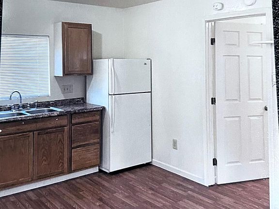 KITCHEN.
Showing entrance to bedroom.