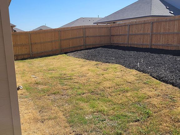 Back yard with lawn and groundcover to save water, programmable automatic sprinkler system