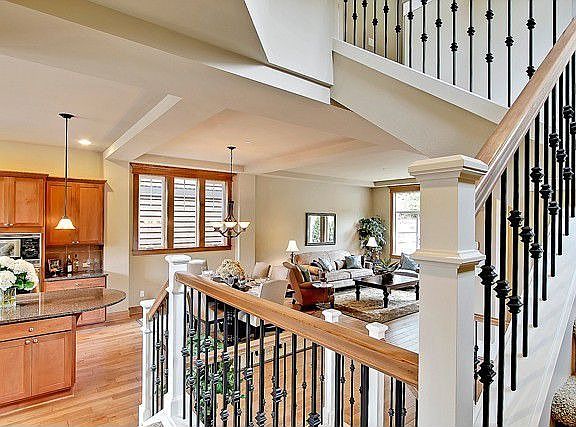 Spacious great room plan features 10' ceiling on main floor with extensive millwork detail and hardw