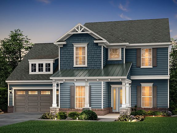 Northridge Exterior 5 features siding, shakes, brick accents and covered front porch.