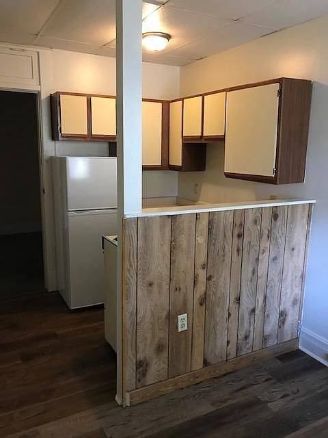 Looking back from living room to kitchen and entry door