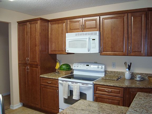 Cabinets, stove and microwave