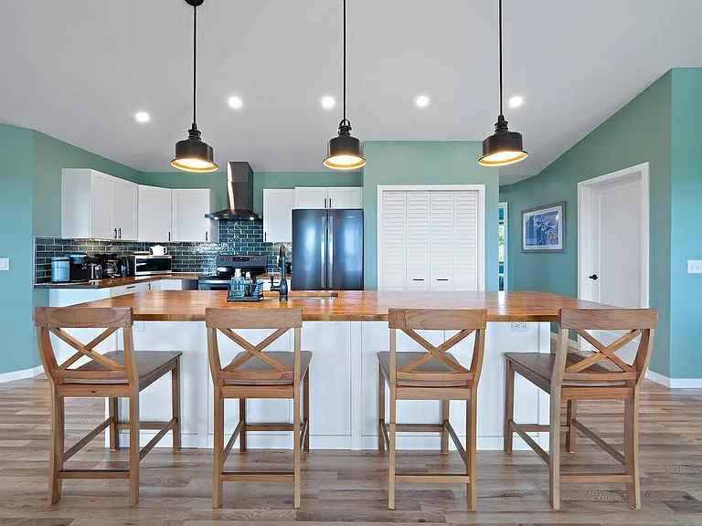 Centerpiece to the kitchen is the huge butcher-block island with plenty of seating