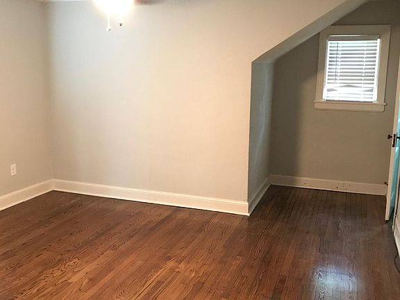 Bedroom two with large walk-in closet and ceiling fan.