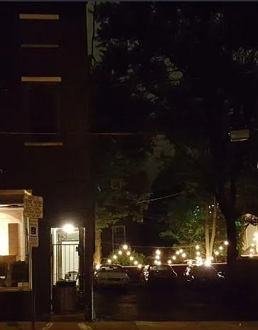 Streetscape on block at night. This is the back of the Sweet Shoppe that is on Duke but can be entered from the back side on East Chestnut Street.