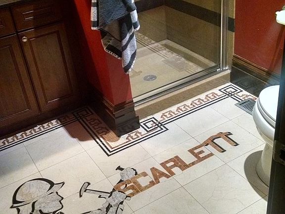 Bath showing old construction company logo inlay