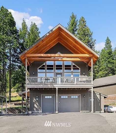 Front of home, 2 car garage. Photos from a similar cabin.