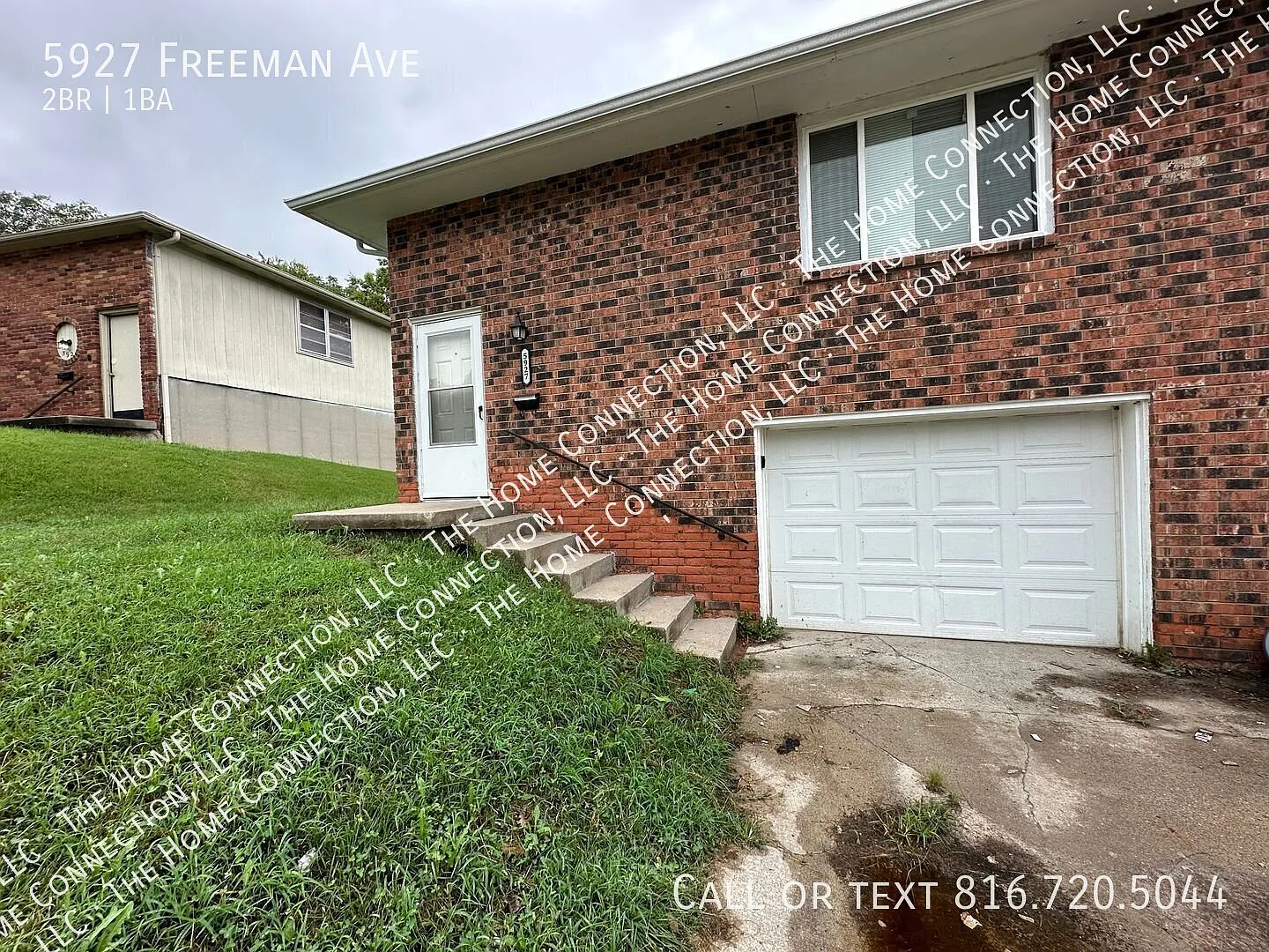 2 Bed / 1 Bath Townhouse with Attached garage & New Flooring! — Photo 1