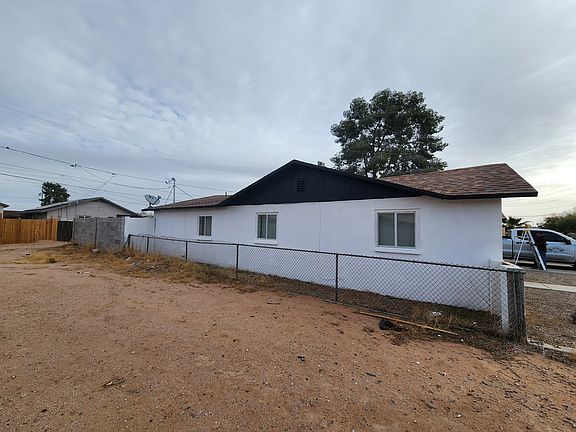 View of the west side of the home from vacant lot adjacent