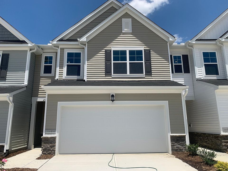 Front of the house with plenty of parking in the drive way.