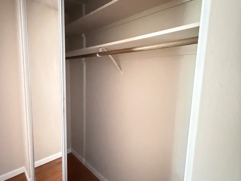 Bedroom 2 also features mirrored closet doors