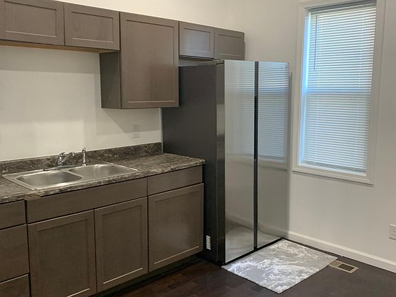Nice kitchen with window and appliances.