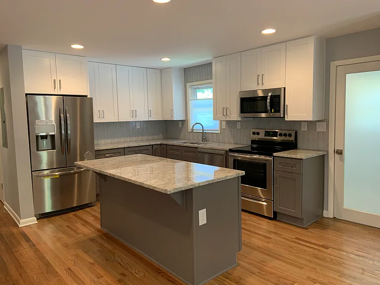 Spacious cabinets to ceiling, granite, dishwasher, full size fridge, microwave, cooktop and oven. Everything you need and more!