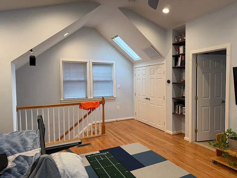 High ceiling has two skylights with shades