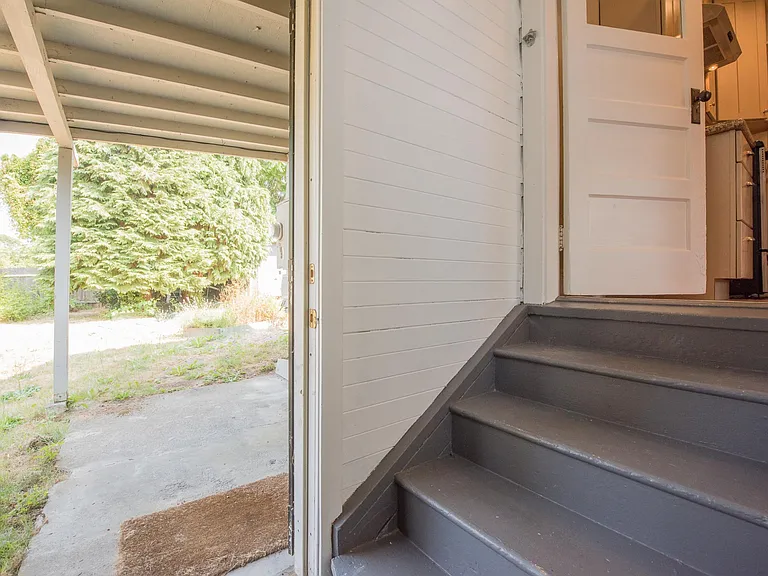 access to backyard, covered patio