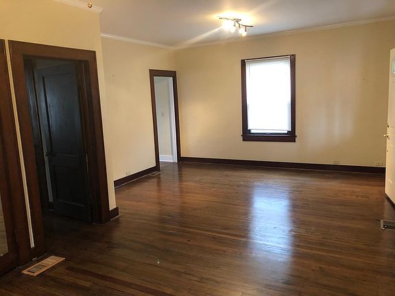 Living room. Kitchen entry door on far left and house entry door on the right. I have had tenants use this room as a living room/ dinning room combination.
