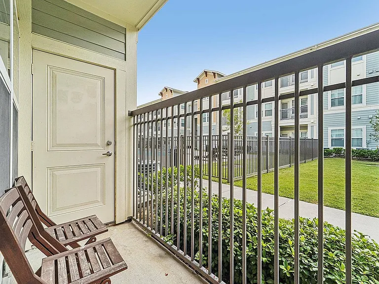 Enjoy your morning coffee on this spacious balcony at The Broadway in Houston, TX.