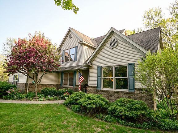 This beauty is peacefully positioned on this 1.25 acre lot with loads of privacy.  City water and natural gas are connected to the home and there is still a functioning well for outdoor watering.