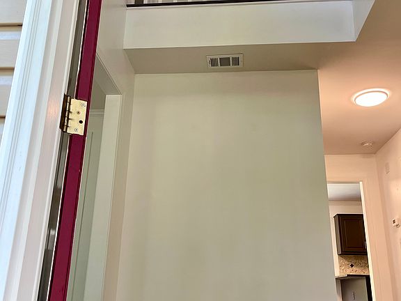 Front door opens to an open foyer with a split level stairwell behind the dining room located to the right.